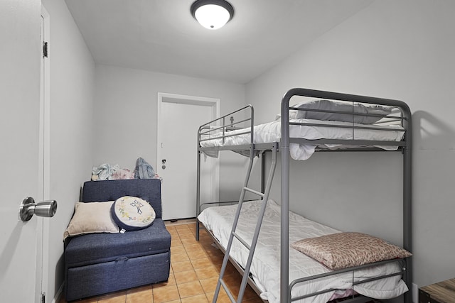 bedroom featuring light tile patterned flooring