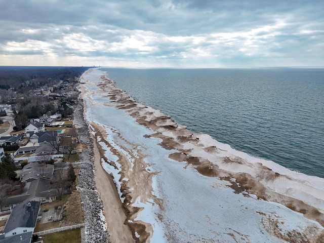 bird's eye view featuring a view of the beach and a water view