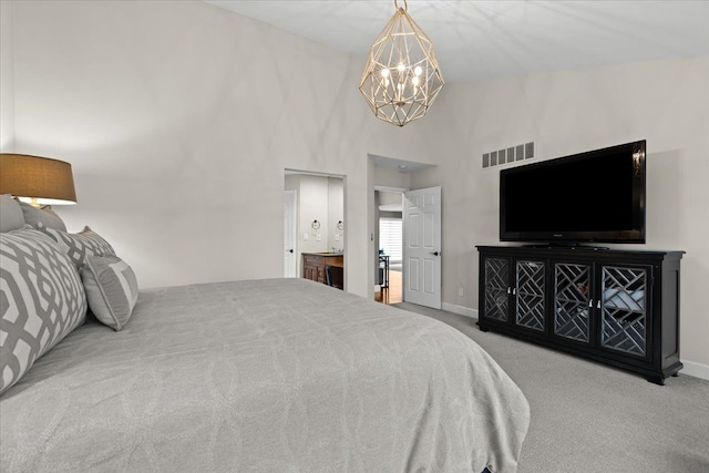 bedroom with carpet, visible vents, and baseboards