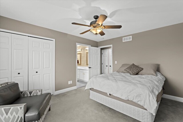 bedroom with light colored carpet, a closet, visible vents, and baseboards