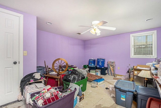 interior space featuring a ceiling fan and visible vents