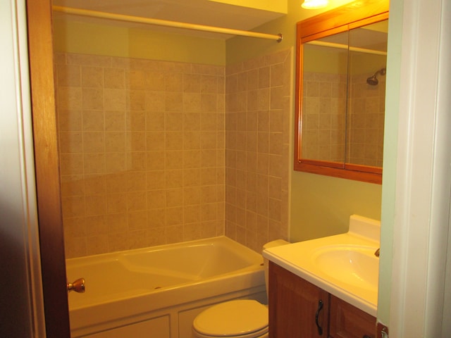 full bathroom with bathtub / shower combination, vanity, and toilet