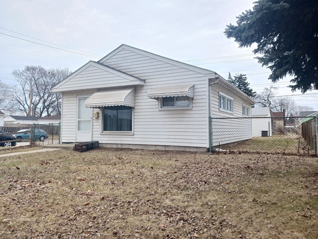 rear view of house with fence