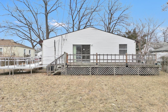 back of property featuring a deck