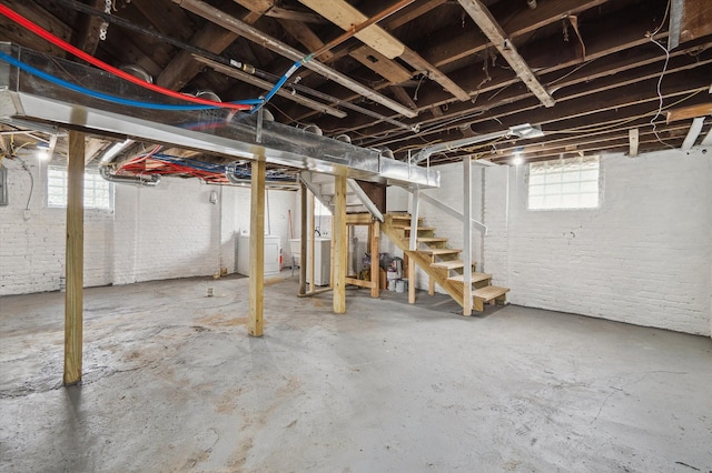 below grade area featuring washer / clothes dryer and stairway