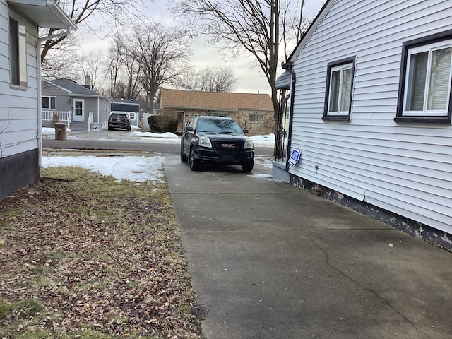 view of yard with concrete driveway