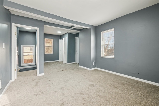 unfurnished bedroom featuring baseboards and carpet floors