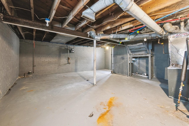 unfinished basement with brick wall