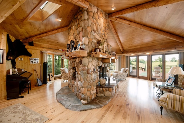 living room featuring hardwood / wood-style floors, beam ceiling, and wooden ceiling