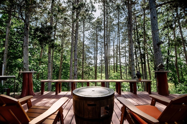 wooden deck featuring a fire pit