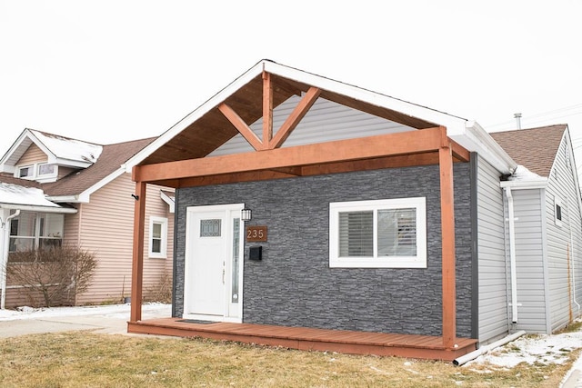 exterior space featuring a shingled roof