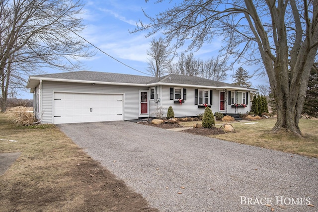 single story home with a garage, driveway, and roof with shingles