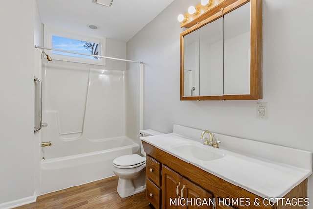 full bathroom featuring shower / bathing tub combination, vanity, toilet, and wood finished floors