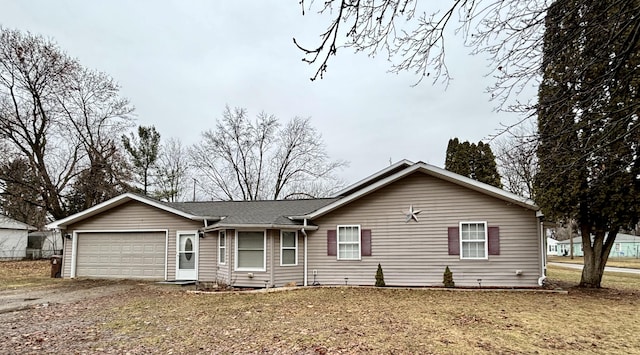 ranch-style house featuring driveway and a garage