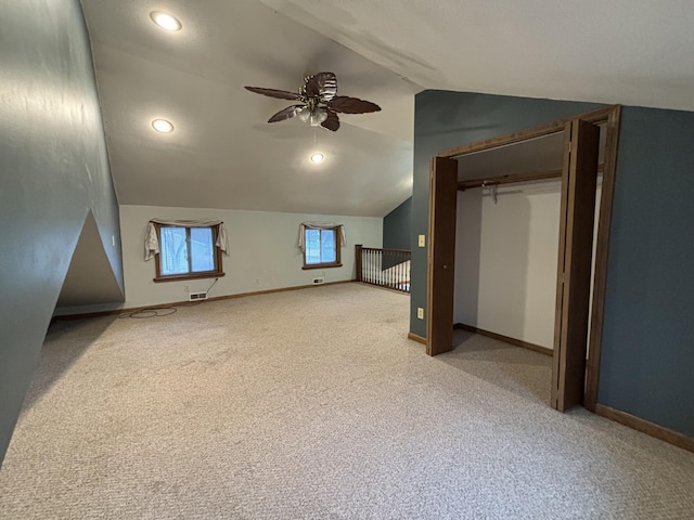 bonus room with light carpet, baseboards, ceiling fan, vaulted ceiling, and recessed lighting