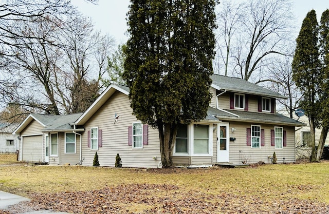 view of front of home featuring a front lawn and an attached garage