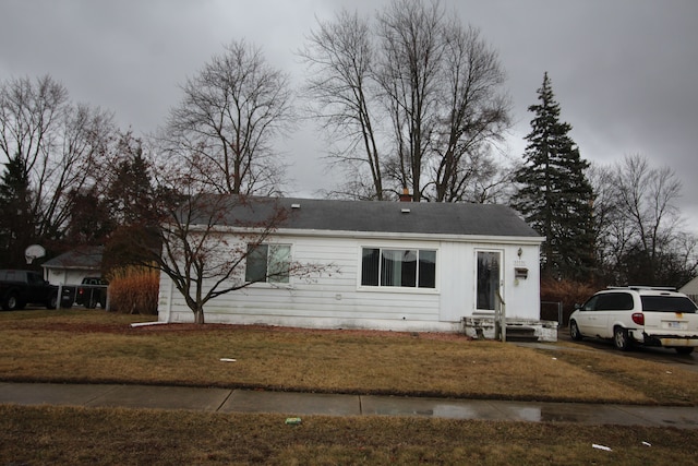 ranch-style house with a front lawn