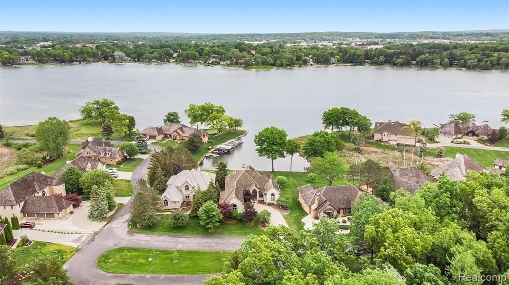 birds eye view of property featuring a water view and a residential view