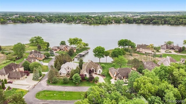 birds eye view of property featuring a water view and a residential view