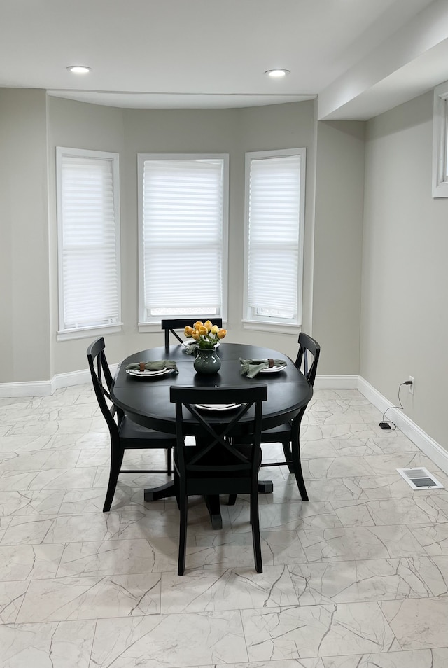 dining area featuring recessed lighting, marble finish floor, visible vents, and baseboards