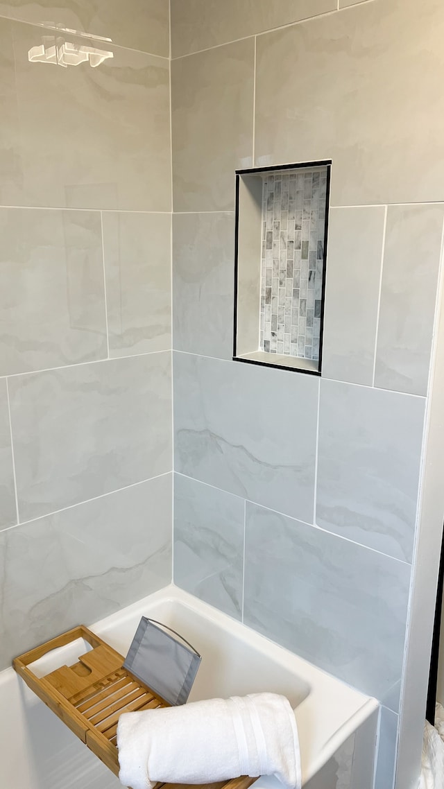 bathroom featuring a tub to relax in and walk in shower