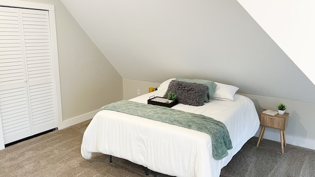 bedroom featuring lofted ceiling, carpet flooring, and baseboards