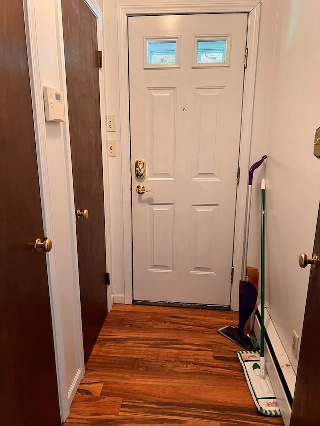 entryway with wood finished floors