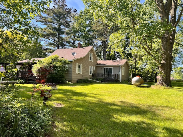 view of yard with a wooden deck