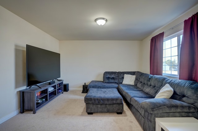 living room featuring baseboards and light carpet