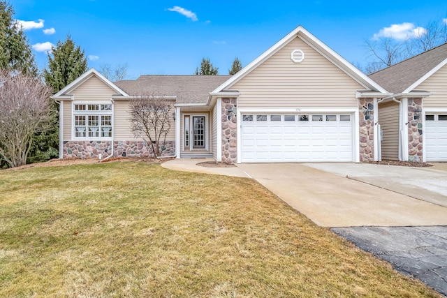 ranch-style house featuring a garage, a shingled roof, concrete driveway, stone siding, and a front yard