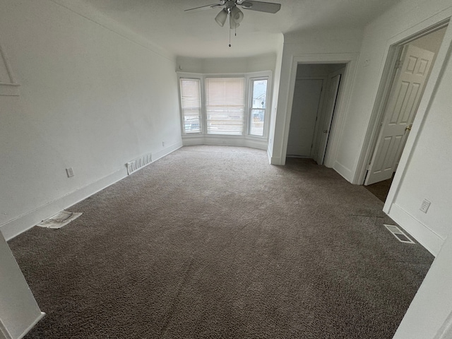 unfurnished bedroom featuring carpet, visible vents, and baseboards