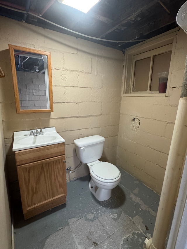 bathroom with toilet and vanity