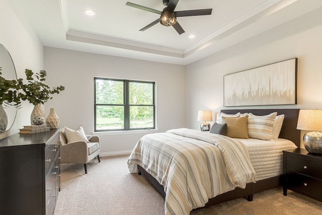 bedroom featuring crown molding, recessed lighting, a raised ceiling, light colored carpet, and baseboards