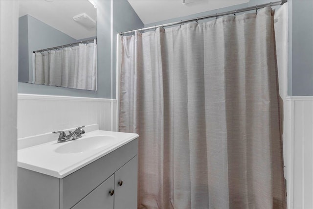 bathroom featuring vanity and wainscoting