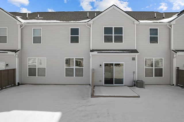 back of property with a patio area, fence, and central AC