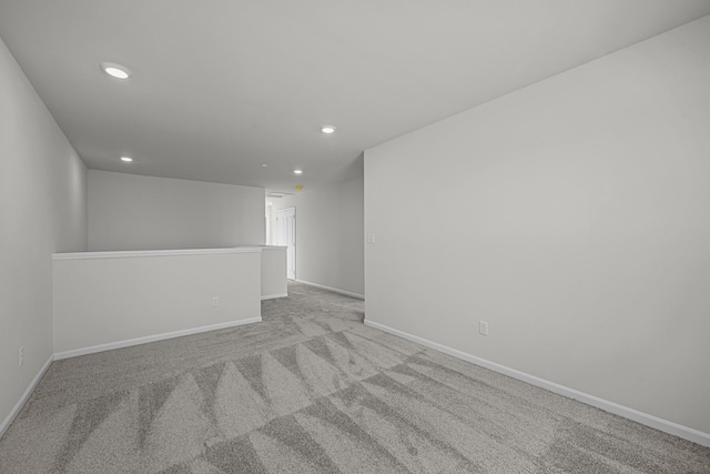 empty room with recessed lighting, carpet flooring, and baseboards