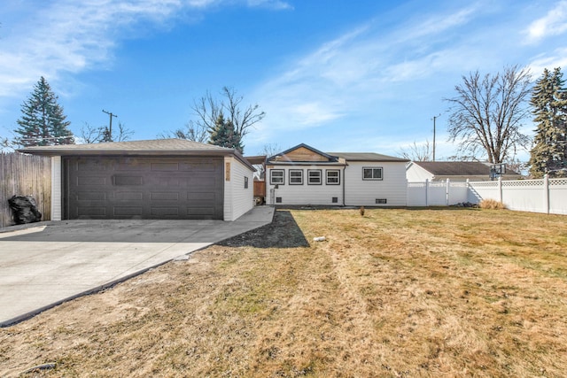 view of front of home featuring a garage, an outbuilding, crawl space, fence, and a front yard