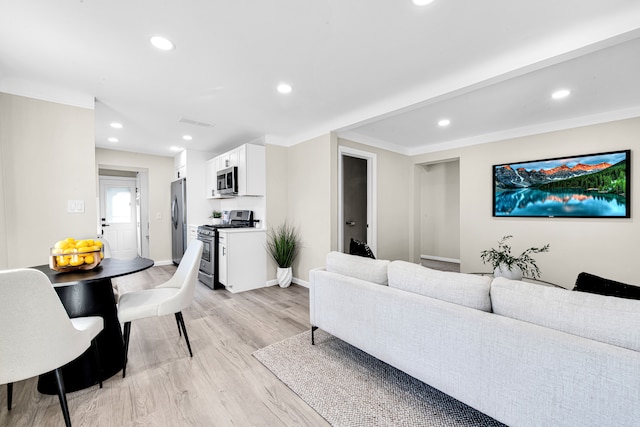 living room with light wood-style floors, visible vents, baseboards, and recessed lighting