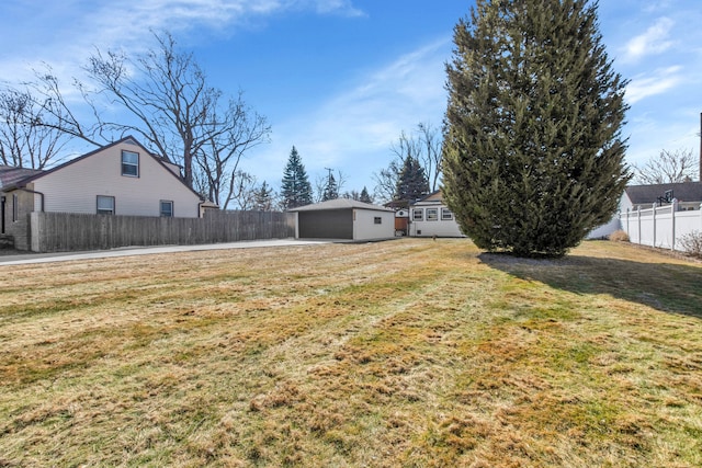 view of yard with an outbuilding and fence