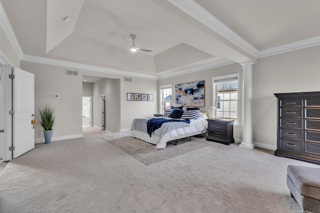 carpeted bedroom with crown molding, a raised ceiling, visible vents, and decorative columns