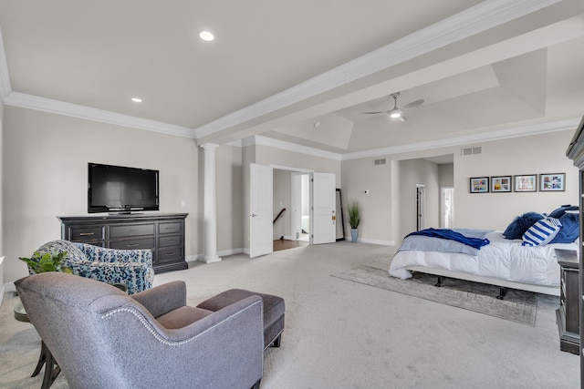 bedroom featuring a tray ceiling, decorative columns, light colored carpet, visible vents, and ornamental molding