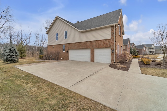 view of property exterior featuring a garage, concrete driveway, and brick siding