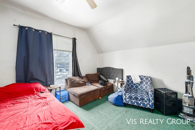 carpeted bedroom featuring vaulted ceiling and a ceiling fan