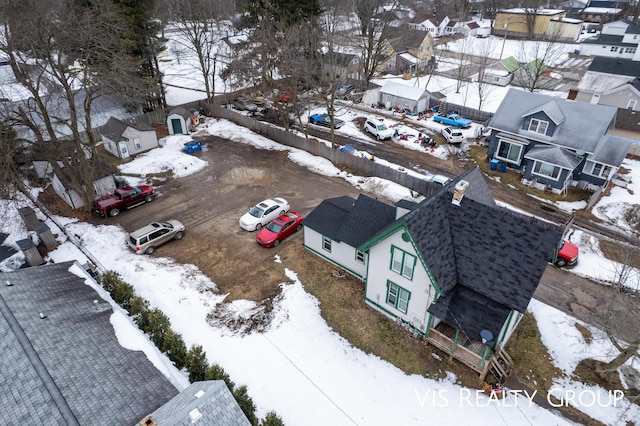 snowy aerial view featuring a residential view