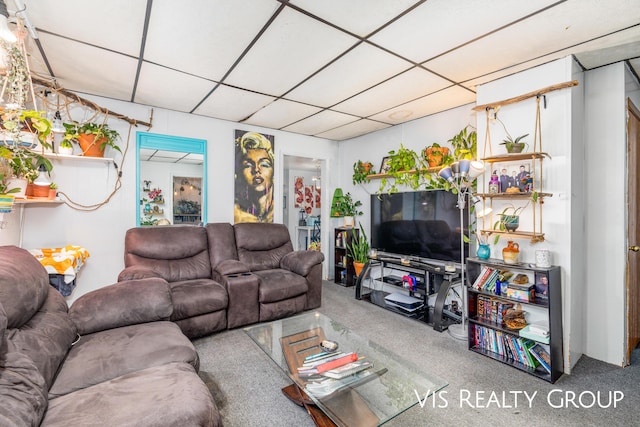 living room with a drop ceiling