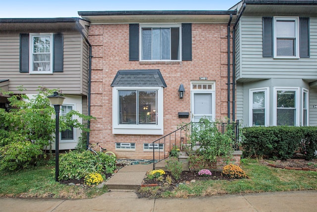 view of property with brick siding