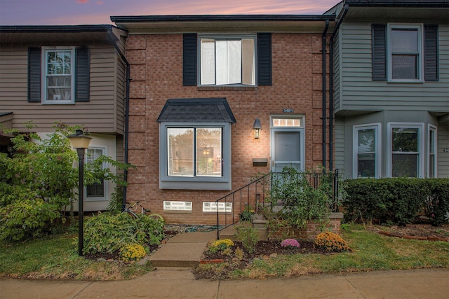 multi unit property featuring brick siding