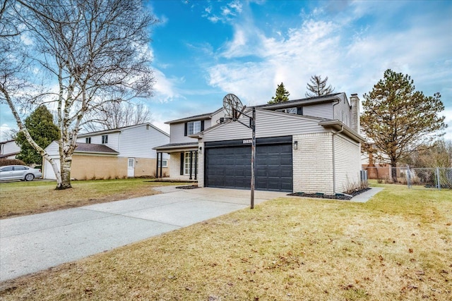 traditional-style house featuring a garage, brick siding, fence, concrete driveway, and a front yard