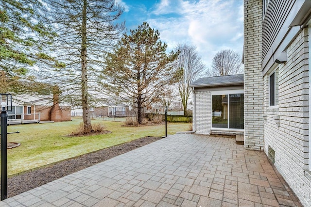 view of patio featuring fence