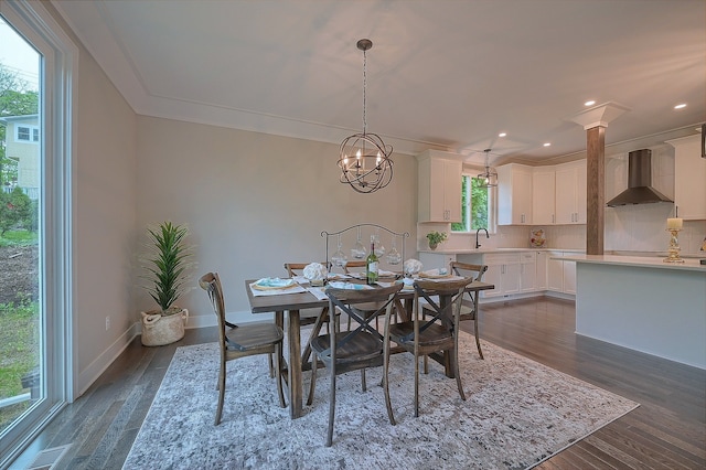 dining area with dark wood-type flooring, visible vents, ornamental molding, and baseboards